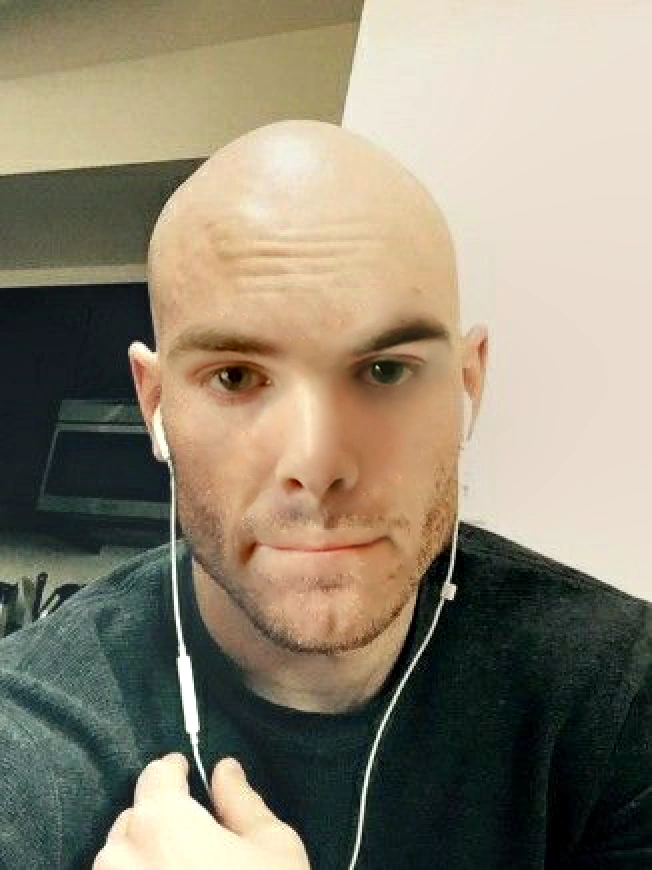 A gloriously bald man